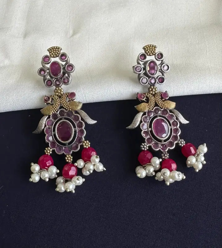 Handcrafted Shiny Dual-Tone Magenta Necklace with Brass, German Silver & Semi-Precious Stones
-Regular Necklace Sets