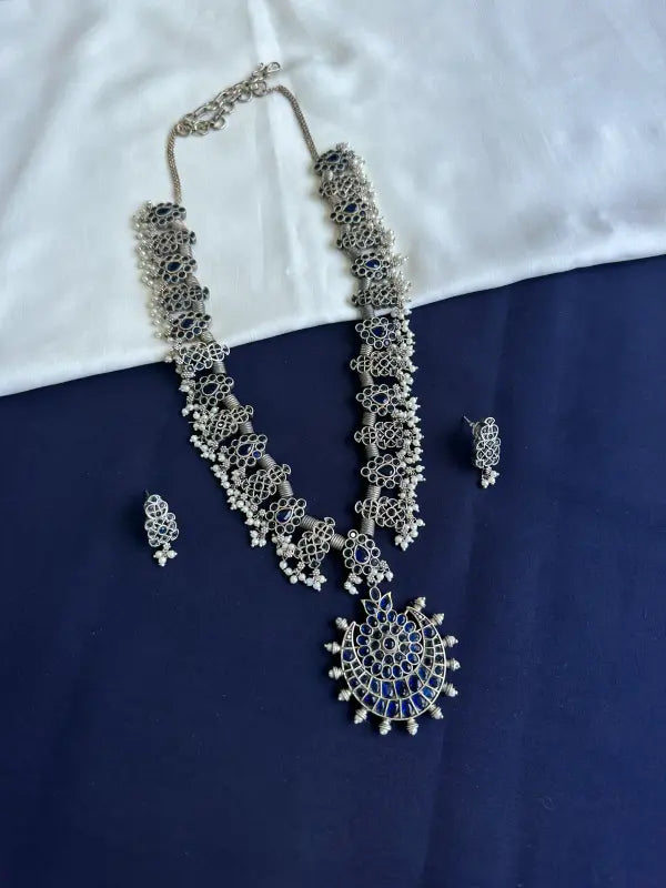 Handcrafted Oxidized Silver Tone Blue Necklace with Brass, Semi-Precious Stones, Beads & German Silver
-Regular Necklace Sets