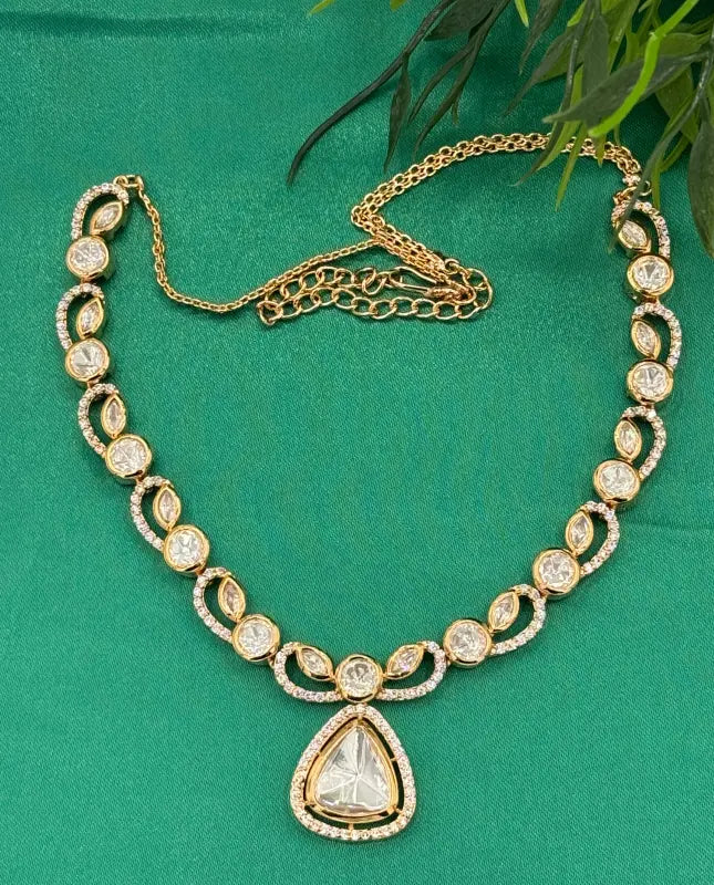 Handcrafted Kundan Jewelry with White Cubic Zirconia and Glass Stone – Golden-Tone Elegance
- Necklace Set