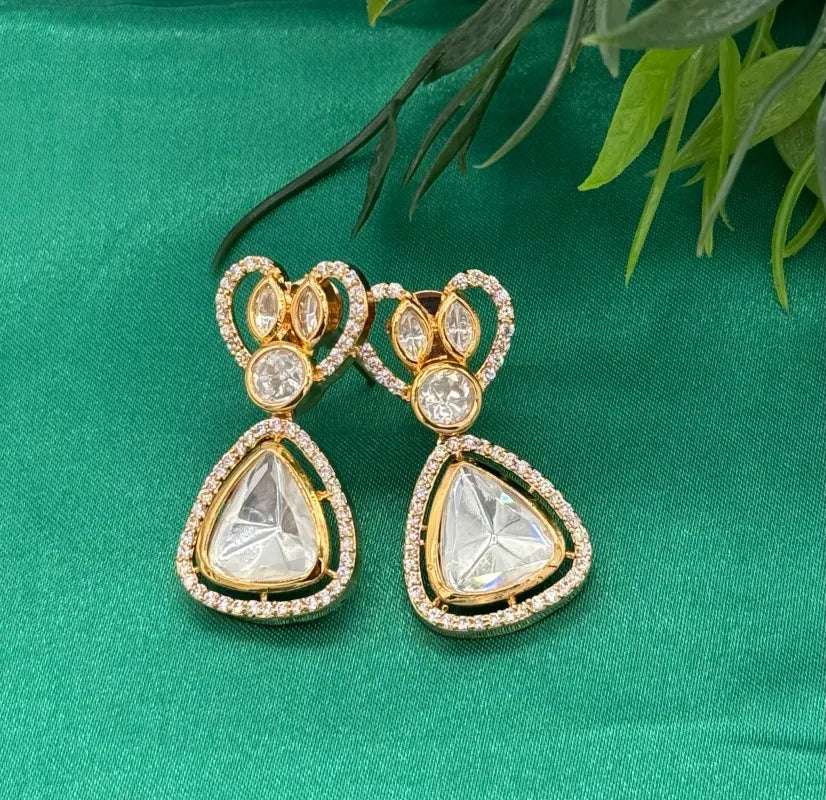 Handcrafted Kundan Jewelry with White Cubic Zirconia and Glass Stone – Golden-Tone Elegance
- Necklace Set